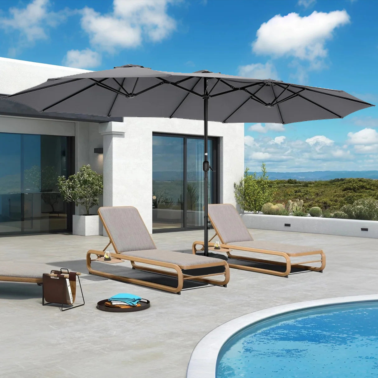 Patioslife Horizon 15 x 9 ft Dark Grey double-sided patio umbrella with base shading two chaise lounges beside a curved pool
