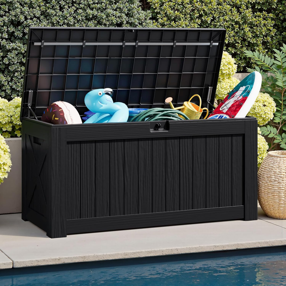 Patioslife Outdoor Resin Deck Box open beside a pool with floats, hose and garden accessories for pool supply storage