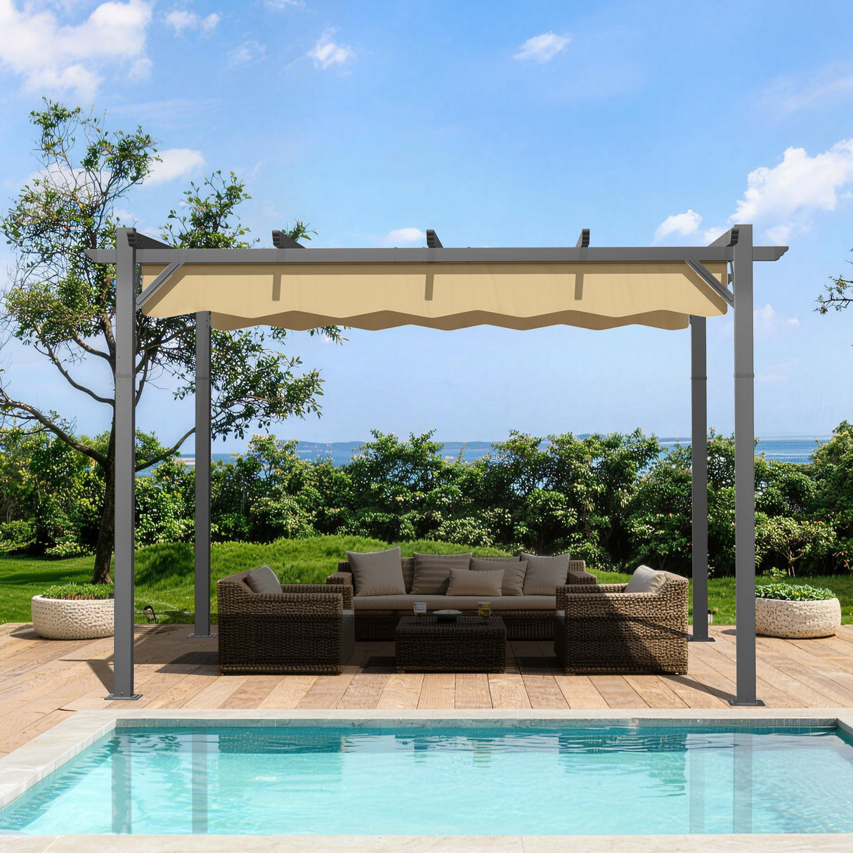 10x10 ft Beige Patioslife Atlantic retractable pergola with adjustable canopy over wicker patio seating beside a pool, garden greenery and ocean view