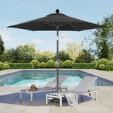 Patioslife 8ft black patio umbrella shading pool loungers in a landscaped backyard pool area
