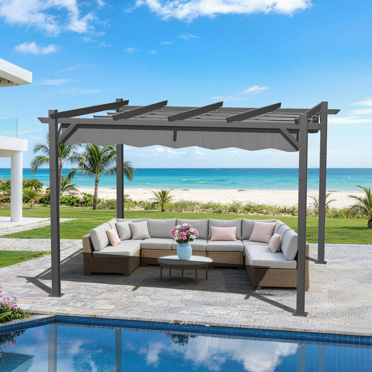10x12 ft Charcoal Patioslife Atlantic retractable pergola with adjustable canopy over patio lounge seating beside a pool, beach view and tropical greenery