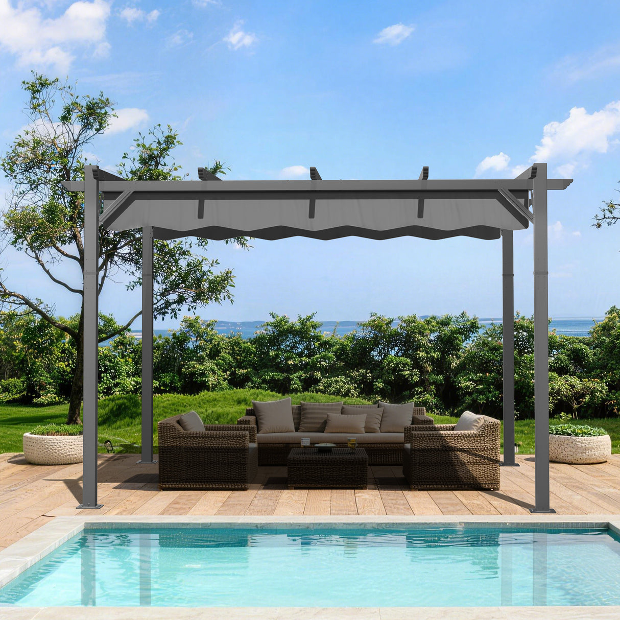 10x10 ft Charcoal Patioslife Atlantic retractable pergola with adjustable canopy over outdoor lounge seating beside a pool, green garden and ocean view
