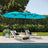 Patioslife Horizon 15 x 9 ft Turquoise double-sided patio led light
umbrella over two loungers beside a pool with garden plants
