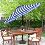 Patioslife Outdoor Market Breeze blue and white striped patio umbrella over an outdoor dining table on a backyard deck