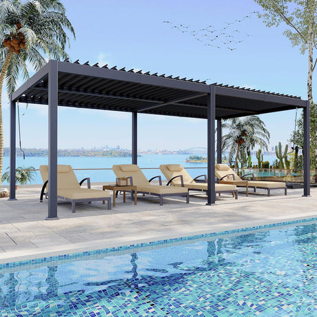 Patioslife Atlantic 10×20ft charcoal aluminium louvered pergola shading poolside loungers with palm trees and waterfront view