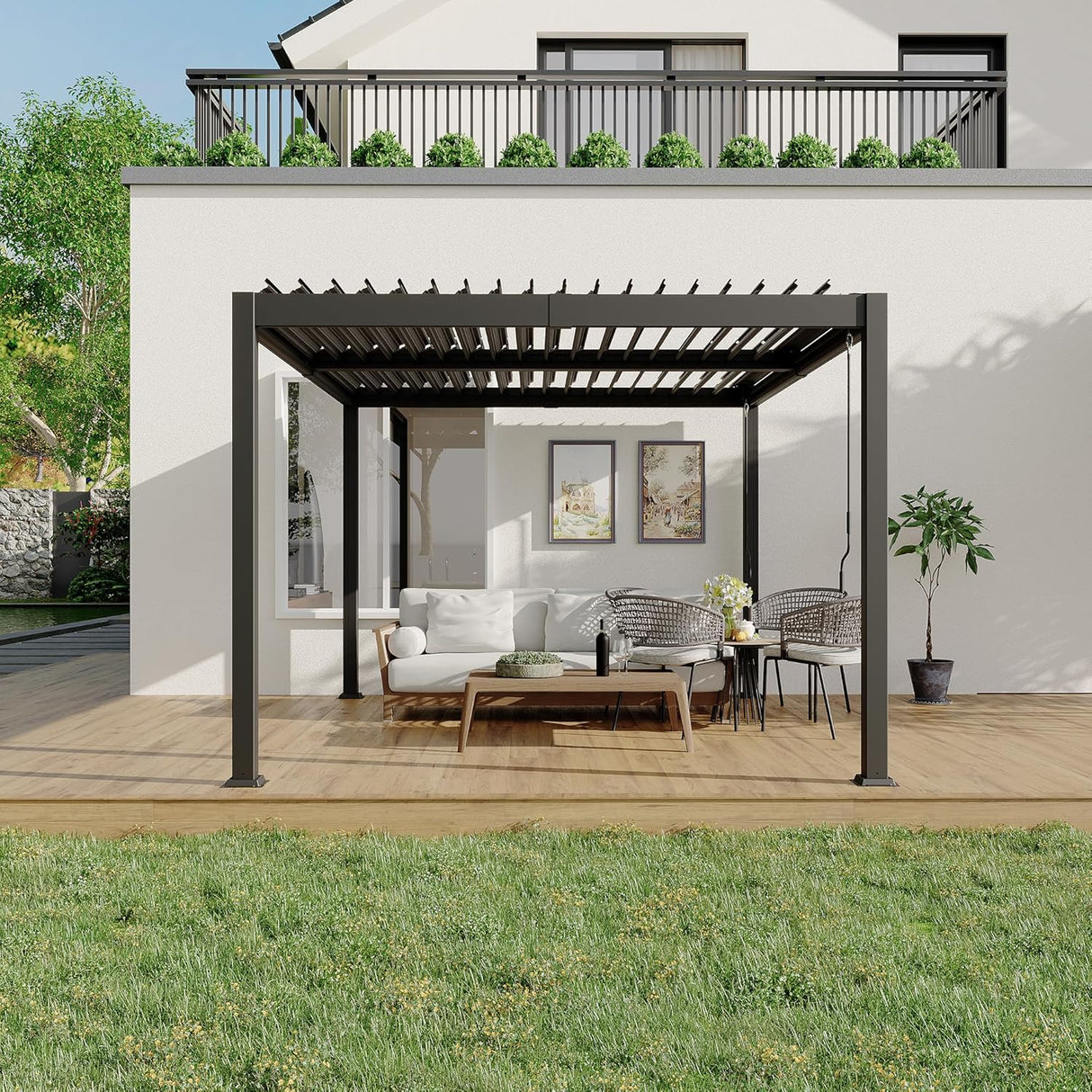 Patioslife Atlantic charcoal aluminum louvered pergola with adjustable roof on a modern backyard deck, shading an outdoor sofa and dining set beside a white house wall