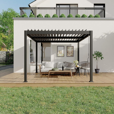 Patioslife Atlantic charcoal aluminum louvered pergola with adjustable roof on a modern backyard deck, shading an outdoor sofa and dining set beside a white house wall