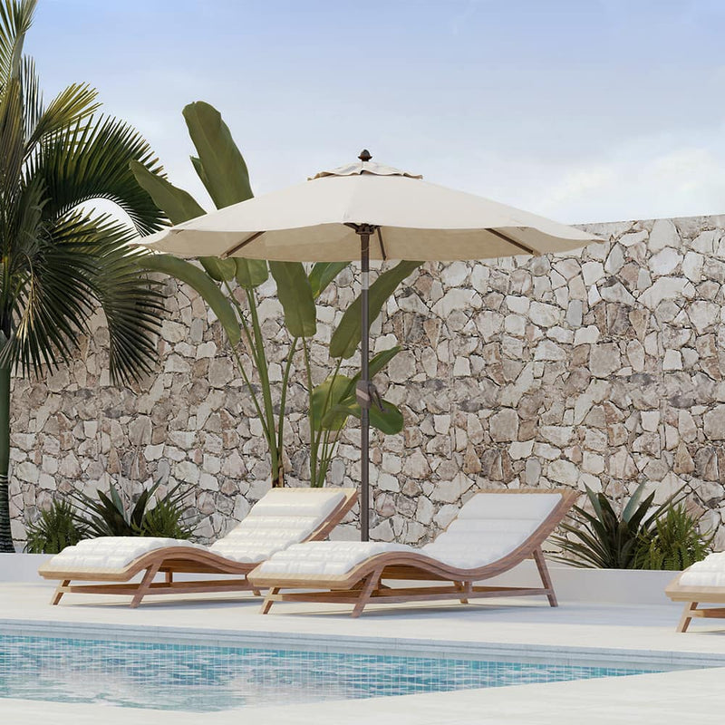 Patioslife 8ft cream patio umbrella shading pool loungers against a stone wall with tropical plants