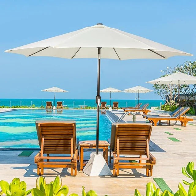 Patioslife Outdoor Market Breeze creamy white patio umbrella beside pool loungers for resort-style backyard shade