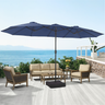 Patioslife Horizon 15 x 9 ft navy blue double-sided patio led light umbrella over a modern outdoor sofa set on an ocean-view deck