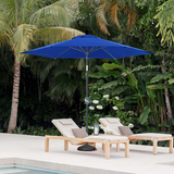 Patioslife 8ft navy blue patio umbrella beside pool loungers in a tropical backyard with palm trees
