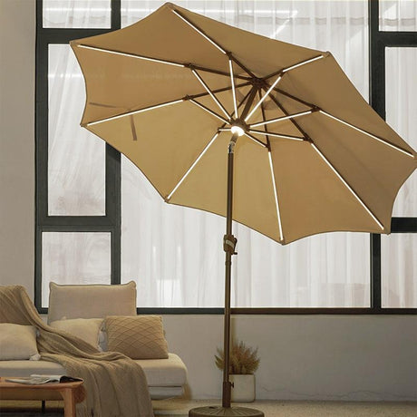 Patioslife 8ft tan patio umbrella with LED rib lights in a cozy outdoor lounge setting